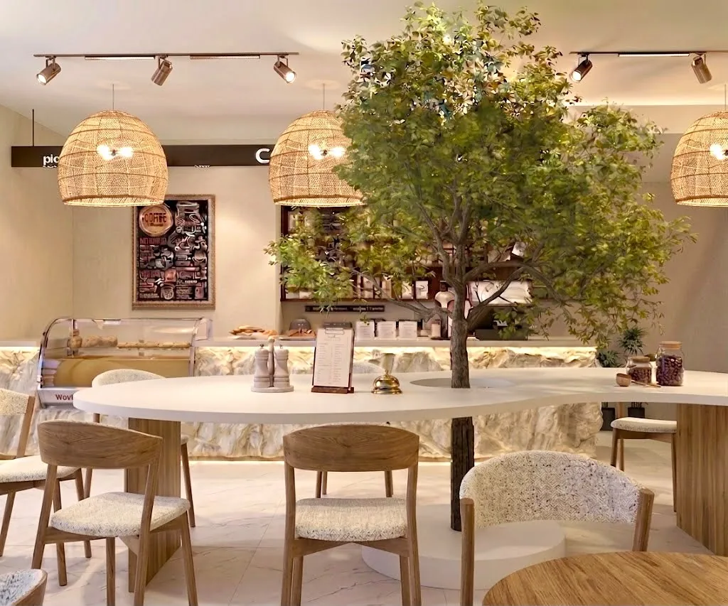 Another view of the same floor, showing the bakery display and the menu wall.